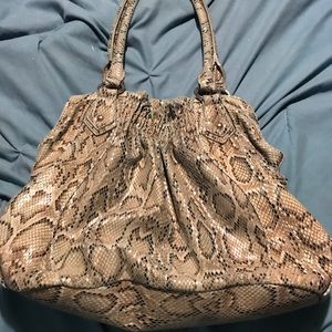 Greenish snake like hand hobo bag